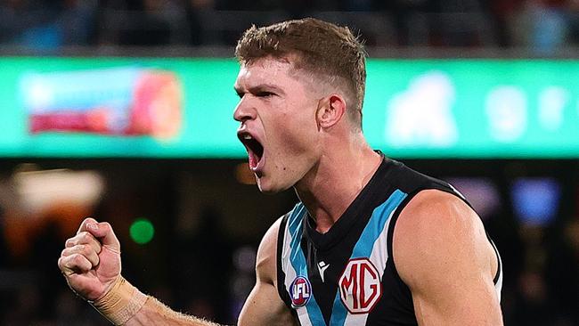 ADELAIDE, AUSTRALIA - MAY 30: Mitch Georgiades of the Power celebrates a goal during the 2024 AFL Round 12 match between the Port Adelaide Power and the Carlton Blues at Adelaide Oval on May 30, 2024 in Adelaide, Australia. (Photo by Sarah Reed/AFL Photos via Getty Images)