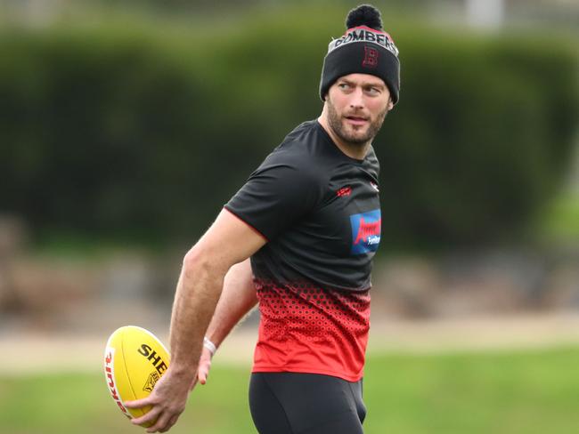 Tom Bellchambers of the Bombers runs with the ball during an Essendon Bombers training session at the Hangar in Tullamarine, Melbourne, Wednesday, August 7, 2019. (AAP Image/Scott Barbour) NO ARCHIVING