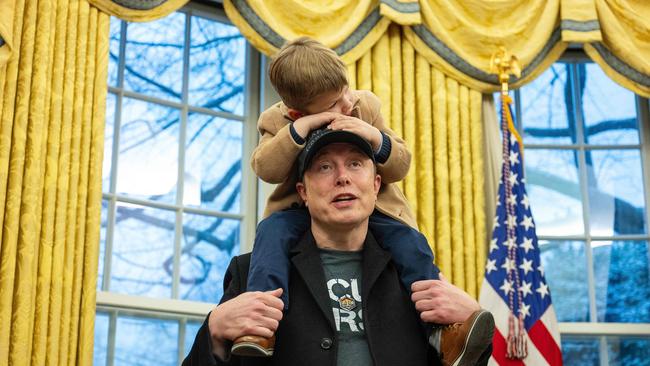 Musk holds his son X on his shoulders as they join US President Donald Trump in the Oval Office of the White House. Picture: Jim Waatson/AFP