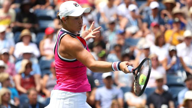 Ash Barty fires a forehand back to China’s Qiang Wang at the US Open in New York. Picture: Getty Images