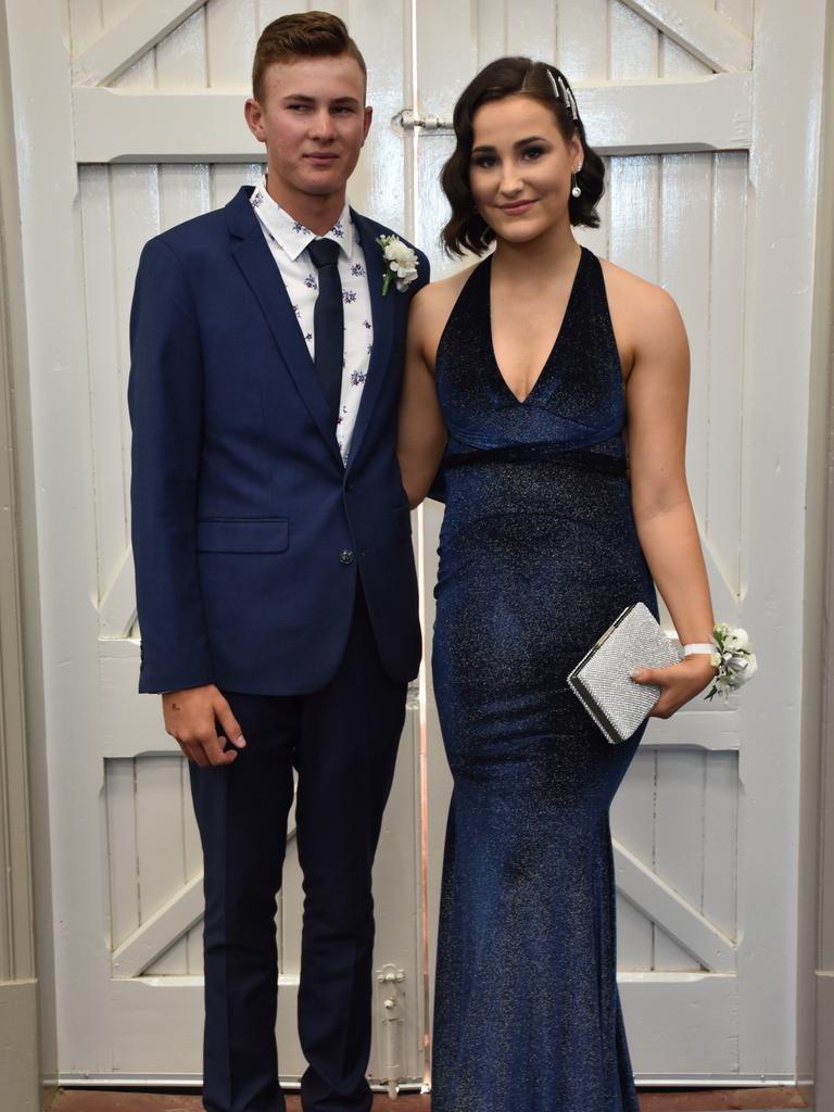 Ryley Lever and Ella Murphy celebrate graduation at the Assumption College formal.