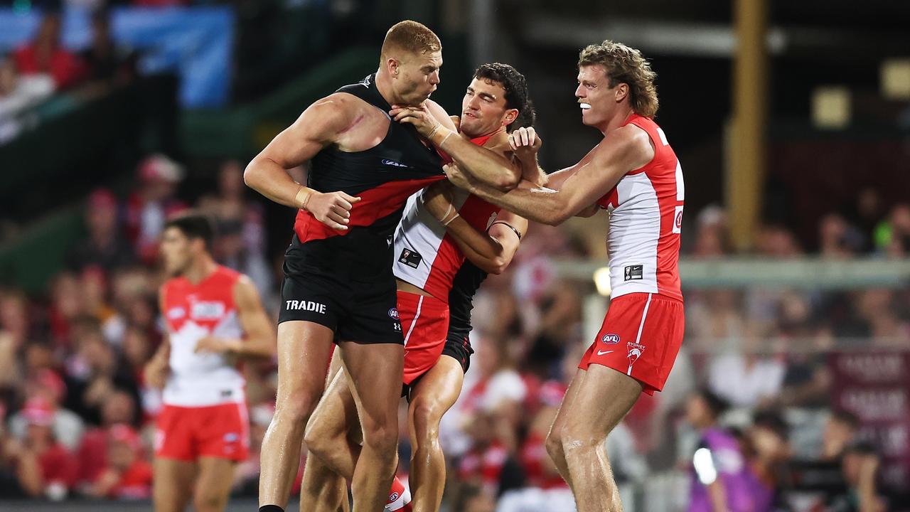 Swans players wrestle with Peter Wright. (Photo by Matt King/AFL Photos/via Getty Images)
