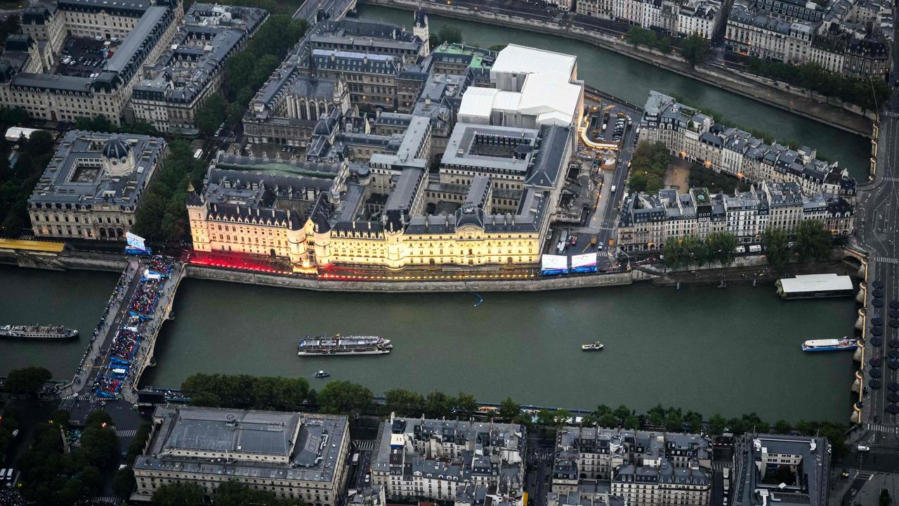 The delegation boats navigate the Seine by the Concergerie during the opening ceremony of the Paris 2024 Olympic Games in Paris. Picture: AFP.