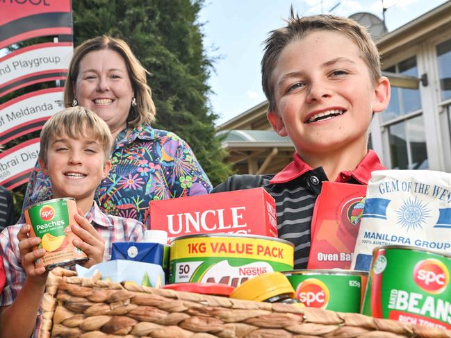 APRIL 16, 2025: Cambrai primary school students Indie Ryan, Felicity Fiebig, Preston Wills, Samuel Nuske, Principal Leila Kasprzak and Darren Fiebig with a food hamper. The school received an Advertiser Foundation Drought Grant to operate a community pantry to create and buy hampers to support 15 families during term. Picture: Brenton Edwards