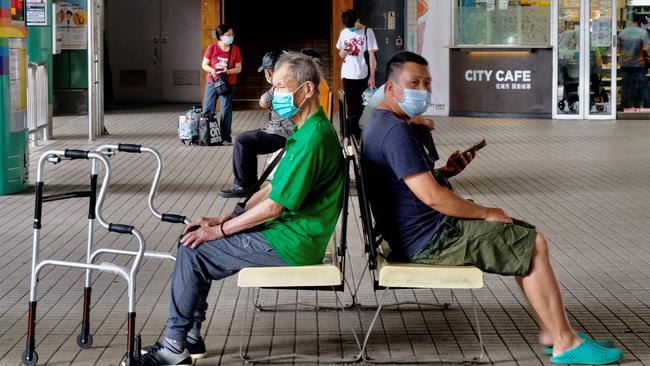 Local residents pictured wearing face masks after Taiwan bumped up its alert level in the wake of a new wave of coronavirus infections. Picture: AFP