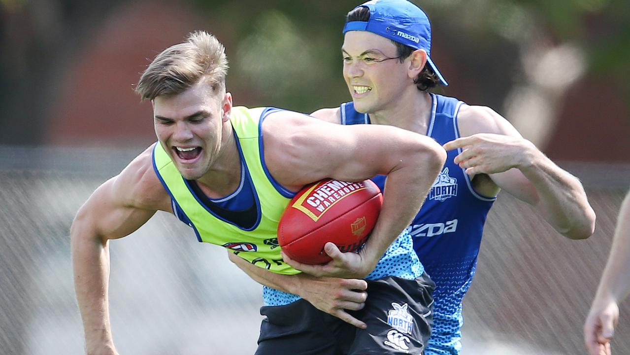 New Kangaroo Jasper Pittard tackles Mason Wood. Picture: Michael Klein