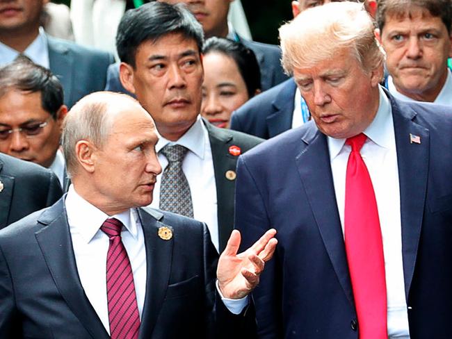 President Donald Trump and Russia President Vladimir Putin talk during APEC. Picture: AP