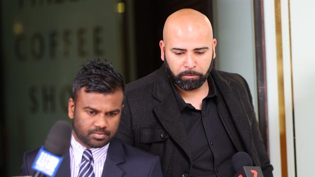 Hashem El Asmar pictured (right) as he leaves Downing centre courts. Picture: NCA NewsWire / Damian Shaw