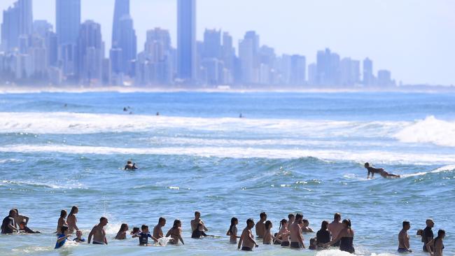 Beach goers and Surfers enjoy the last day of her school holidays at Burleigh Heads on a glorious Gold Coast day. Picture: Adam Head