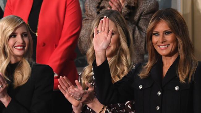 Melania Trump (R) waves, flanked Ivanka Trump (L). Picture: AFP.