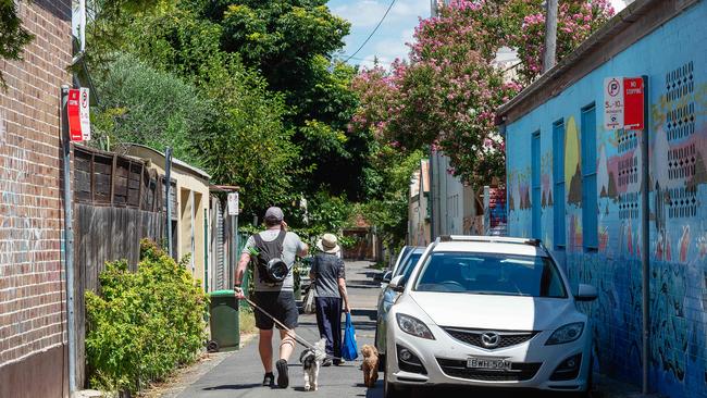 Pedestrians walk along Fitzroy Lane. Picture: Monique Harmer