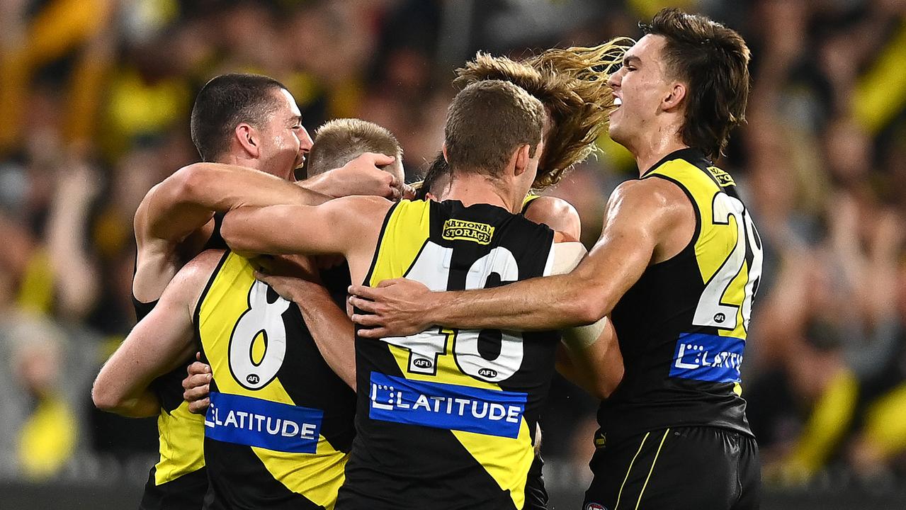 The Tigers celebrate a Jack Riewoldt goal against the Bulldogs. Picture: Quinn Rooney/Getty Images