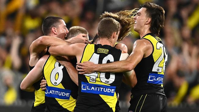 The Tigers celebrate a Jack Riewoldt goal against the Bulldogs. Picture: Quinn Rooney/Getty Images