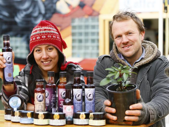 Corinne Ooms and Chris Chapman at their Wild Pepper Isle stall at the Hobart Farmers Market. Picture: MATT THOMPSON