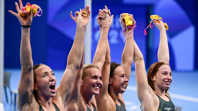Team Australia Australia's Mollie O'callaghan, Australia's Lani Pallister, Australia's Brianna Throssell and Australia's Ariarne Titmus celebrate after winning the final of the women's 4x200m freestyle relay swimming event during the Paris 2024 Olympic Games at the Paris La Defense Arena in Nanterre, west of Paris, on August 1, 2024. (Photo by FranÃ§ois-Xavier MARIT / AFP)