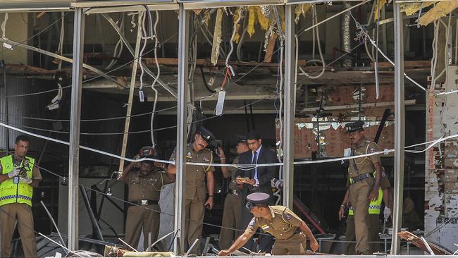 Sri Lankan police inspect the blast spot at the Shangri-la hotel in Colombo. Picture: Chamila Karunarathne