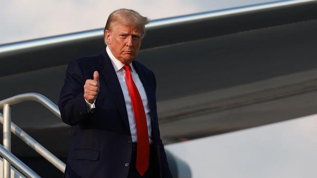 An officially 25 pounds (11kg) lighter Donald Trump lands in Atlanta. Picture: AFP