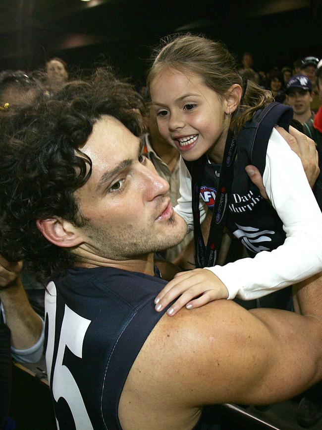 Brendan Fevola with Mia after one of his games.