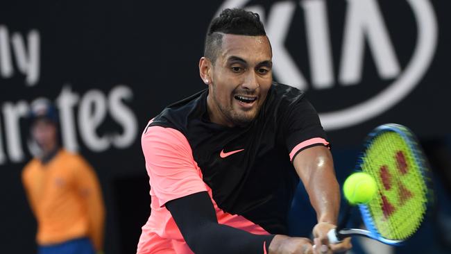 Australia's Nick Kyrgios hits a return during his men's singles third round match against France's Jo-Wilfried Tsonga. Photo: AFP