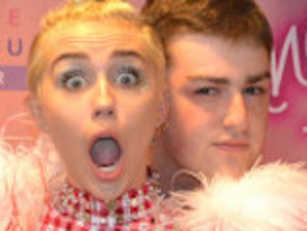 Miley Cyrus is shown backstage during a photo-op meet & greet for fans on August 1st, 2014 at Nassau Colliseum with a super Miley fan named David from New York City. During the photo-op, David reportedly asked Miley to be his "first and last kiss with a girl" and Miley responded by jokingly saying he would be her "first and last kiss with a boy." Then Miley pretended to embrace in a tongue kiss with David. In another photo, David is shown groping Miley's breasts while she jokingly makes a shocked expression. <P> Pictured: Miley Cyrus and David <P> <B>Ref: SPL816359 060814 </B><BR/> Picture by: SFP / Splash News<BR/> </P><P> <B>Splash News and Pictures</B><BR/> Los Angeles: 310-821-2666<BR/> New York: 212-619-2666<BR/> London: 870-934-2666<BR/> photodesk@splashnews.com<BR/> </P>