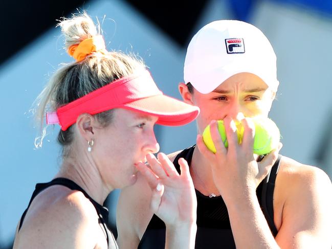 ADELAIDE, AUSTRALIA - JANUARY 04: Ashleigh Barty of Australia and Storm Sanders of Australia discuss tactics during their doubles match against Cori Gauff of the USA and Catherine McNally of the USA during day three of the 2022 Adelaide International at Memorial Drive on January 04, 2022 in Adelaide, Australia. (Photo by Sarah Reed/Getty Images)