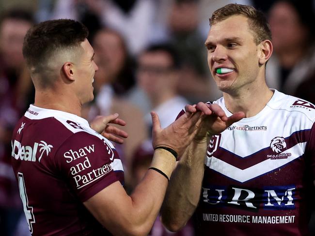 SYDNEY, AUSTRALIA - JULY 21: Tom Trbojevic of the Sea Eagles celebrates with team mate Reuben Garrick after scoring a try during the round 20 NRL match between Manly Sea Eagles and Gold Coast Titans at 4 Pines Park, on July 21, 2024, in Sydney, Australia. (Photo by Brendon Thorne/Getty Images)