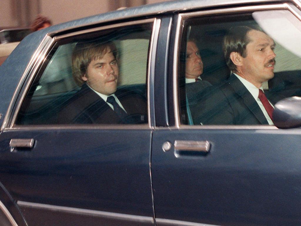 13 April, 1987: John Hinckley being escorted from District Court in Washington. 