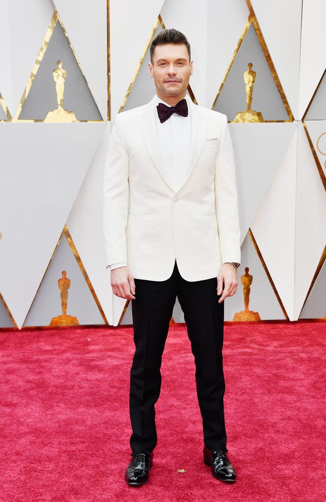 White out. E! host Ryan Seacrest posed for an early photo. Picture: Getty Images