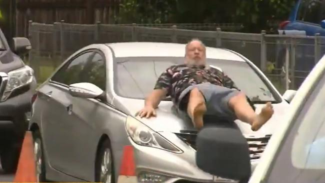 A Cairns man has been run down while trying to stop a car that pushed into the queue of a drive-through Covid testing clinic. Picture: #9Today