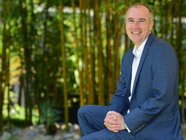 Gerard Whateley in the gardens outside the new SEN office in South Melbourne. Picture: Stephen Harman