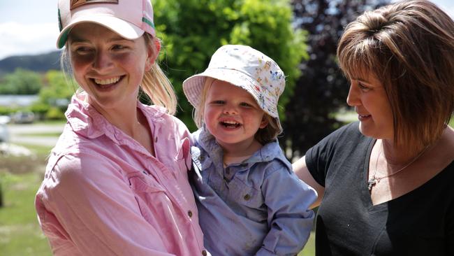 Chelsea Davies’ daughter Ruby, 19 months, was lifted to safety by Jodie Greenhalgh (right). Picture: Dean Marzolla