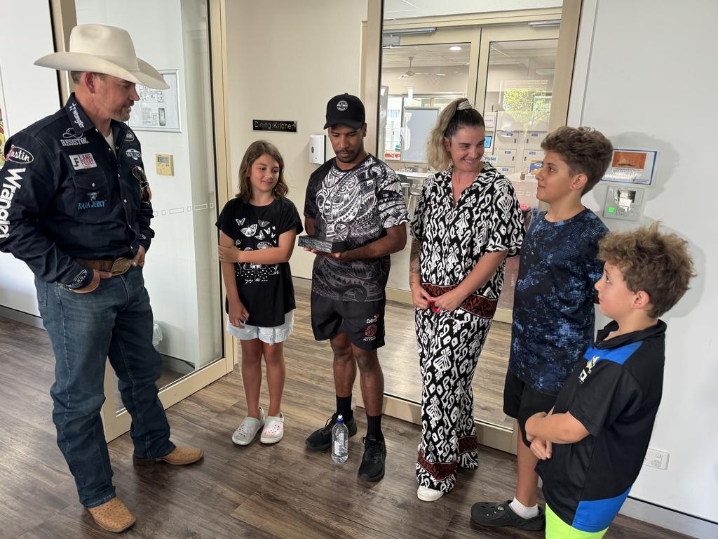 Baylee Moss, Hunter Moss, Katie Moss, Zakoa Moss and Steven Phineasa were gifted with a gold and silver cowboy belt buckle by Matt Merritt as a symbol of their courage and perseverance during their six month old sons, Tobias Phineasa's health battle.