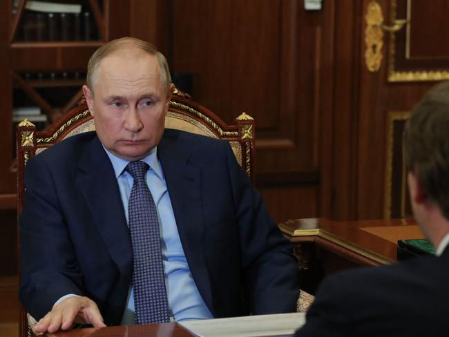 Russian President Vladimir Putin (L) speaks with the newly appointed Aeroflot chairman and CEO, Sergei Aleksandrovsky, during a meeting in the Kremlin, on August 26, 2022. Picture: AFP