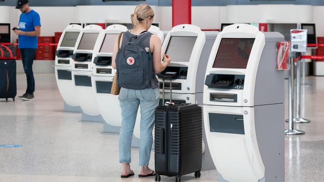 SYDNEY, AUSTRALIA - NewsWire Photos November 30, 2020: Passengers checking into a Qantas Flight at Sydney Domestic Airport. Sydney. Picture: NCA NewsWire / James Gourley