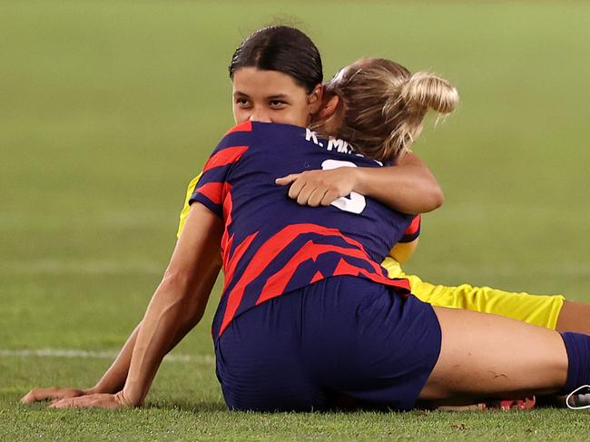 KASHIMA, JAPAN - AUGUST 05: Kristie Mewis #6 of Team United States hugs Sam Kerr #2 of Team Australia following the Women's Bronze Medal match between United States and Australia on day thirteen of the Tokyo 2020 Olympic Games at Kashima Stadium on August 05, 2021 in Kashima, Japan. (Photo by Francois Nel/Getty Images)