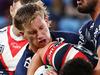 SYDNEY, AUSTRALIA - JUNE 02: Joseph Manu of the Roosters is tackled by Jaxon Purdue and Jordan McLean  of the Cowboys during the round 13 NRL match between Sydney Roosters and North Queensland Cowboys at Allianz Stadium, on June 02, 2024, in Sydney, Australia. (Photo by Jeremy Ng/Getty Images)