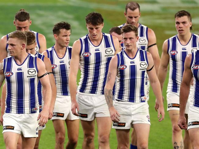 PERTH, AUSTRALIA - APRIL 24: The Kangaroos leaves the field at the main break during the 2021 AFL Round 06 match between the Fremantle Dockers and the North Melbourne Kangaroos at Optus Stadium on April 24, 2021 in Perth, Australia. (Photo by Will Russell/AFL Photos via Getty Images)