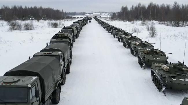 Russian military vehicles wait for loading to a military cargo plane to depart for Kazakhstan. Picture: AFP