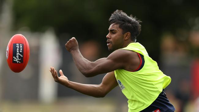 Exciting young gun Kysaiah Pickett fires out a handpass at Melbourne training. Picture: Robert Cianflone/Getty