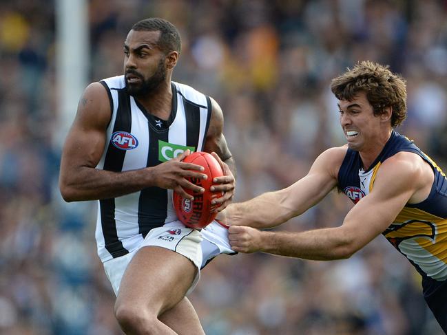 AFL Round 20 - West Coast Eagles vs Collingwood Pies at Patersons Stadium, Perth. Photo by Daniel Wilkins. PICTURED- Collingwood's Heritier Lumumba is tackled by Eagle Jamie Cripps.