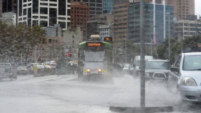 Flooding on Queensbridge Street, Melbourne due to the wet windy conditions. Picture: Nicole Garmston