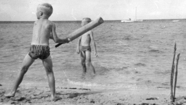 Dean Jones as a boy enjoying some beach cricket.