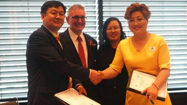 An unnamed representative from the China Gold Group, New South Wales Energy and Resources Minister Don Harwin, Chinese Embassy in Sydney Commerce Counselor Wang Hongbo and Sally Zou at a signing ceremony in March.