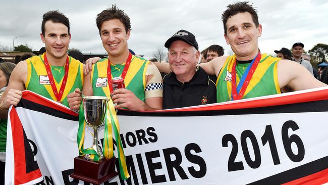 Joel Galvin (right) with brothers Mitch and Bryce and father Gary after the Division 2 premiership in 2016. Picture: Steve Tanner