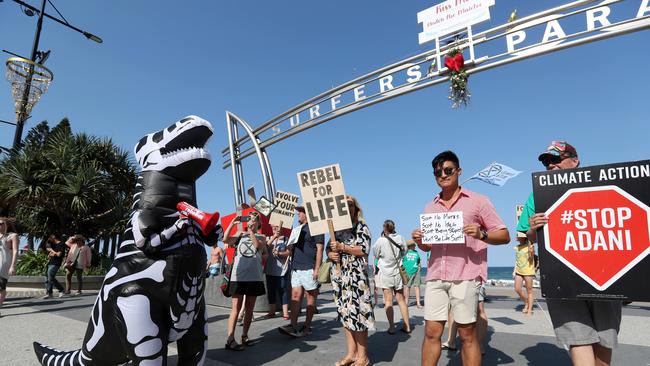 Protesters under the iconic Surfers Paradise sign. Picture: Nigel Hallett