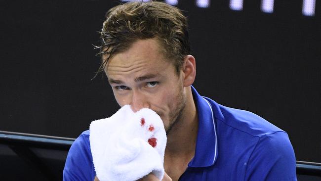 The brutal Melbourne heat caused Daniil Medvedev’s nose to bleed. Picture: AP/Andy Brownbill