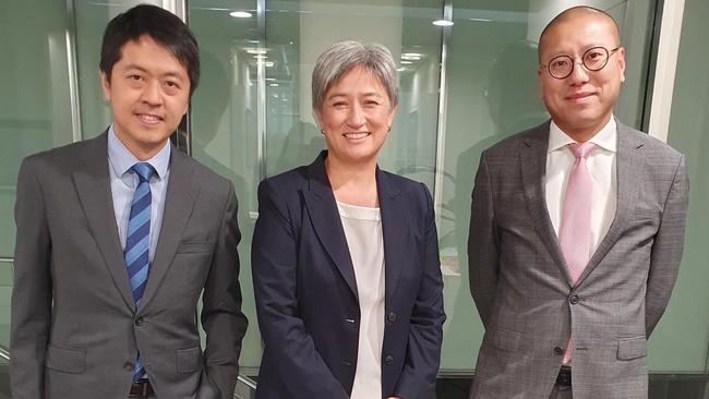 Ted Hui (left) and Kevin Yam with Foreign Minister Penny Wong in January at the Australian government offices in Adelaide. On Monday, the Hong Kong police announced they two have been accused of “collusion”. Picture: Supplied