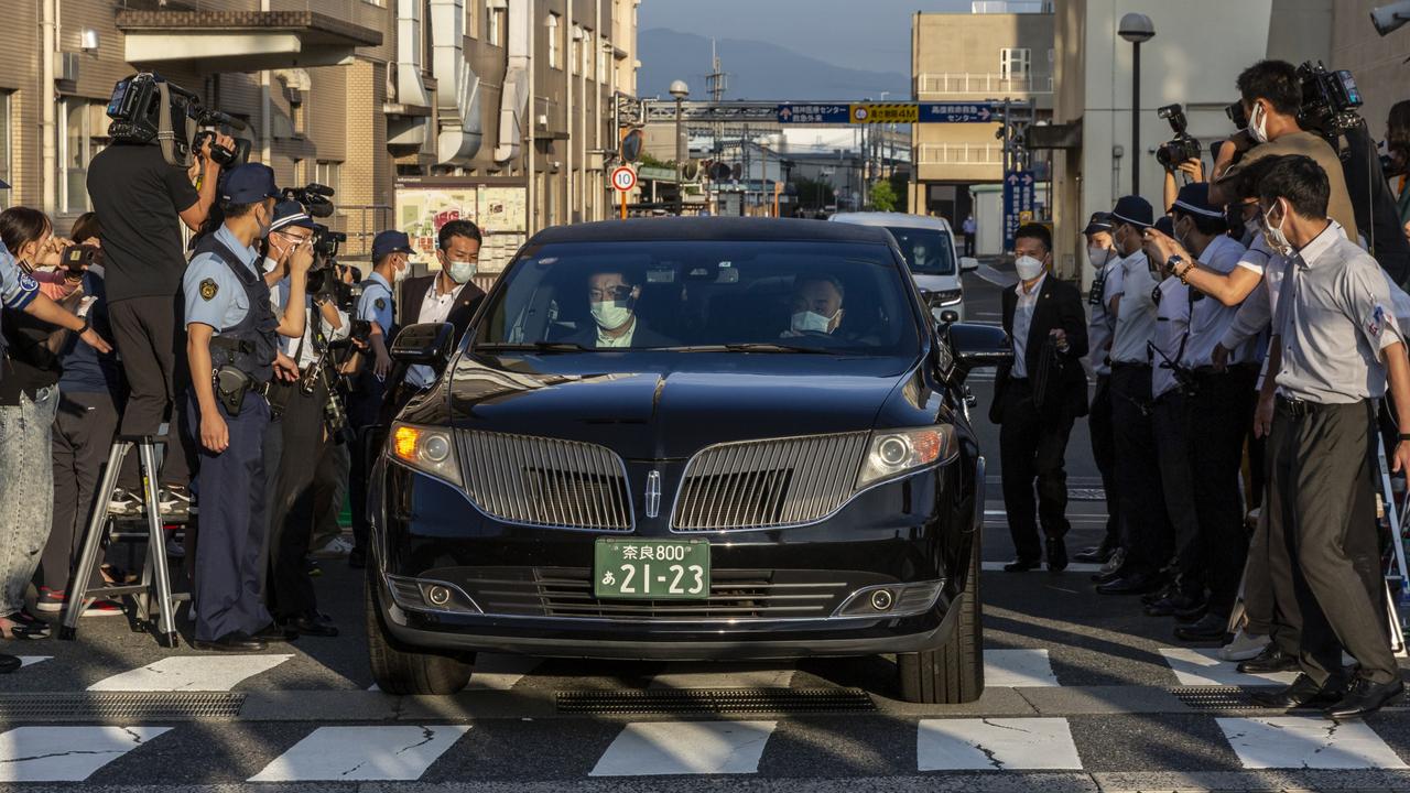 A car believed to be carrying the body of Japan’s former prime minister Shinzo Abe leaves Nara Medical University Hospital on Saturday. Picture: Getty