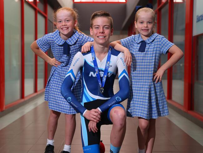 Joshua Brodie with his proud sisters Elise and Jorja after receiving his award. Picture: Phil Rogers