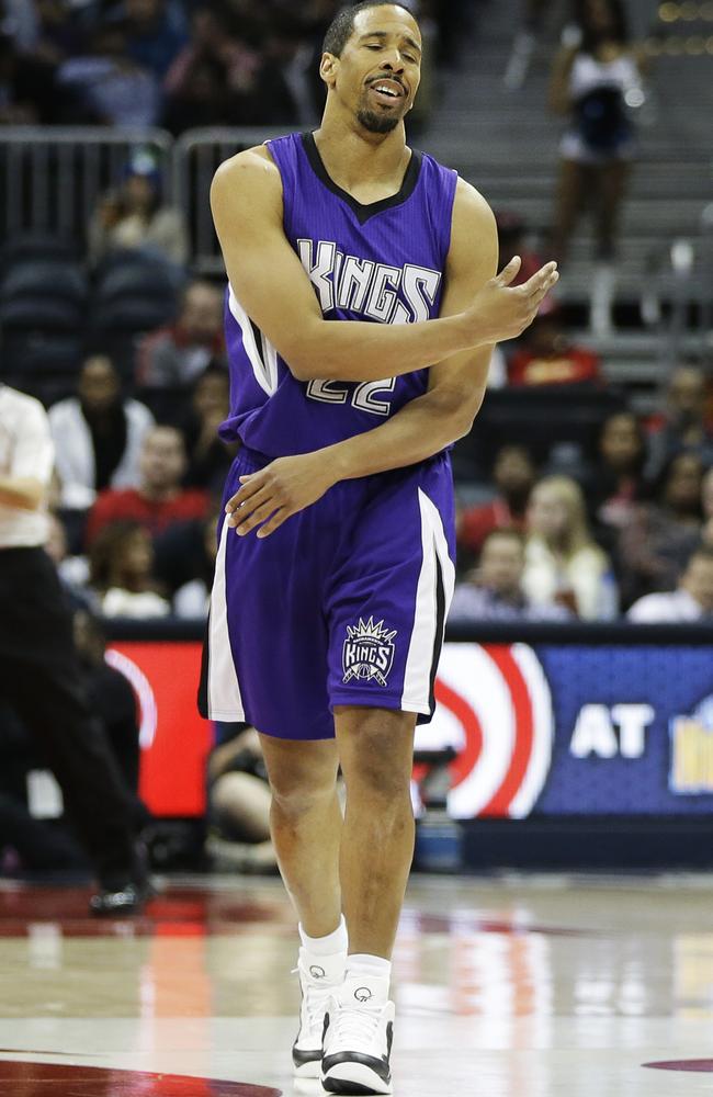 Sacramento Kings' Andre Miller reacts after officials called a foul on teammate Jason Thompson.